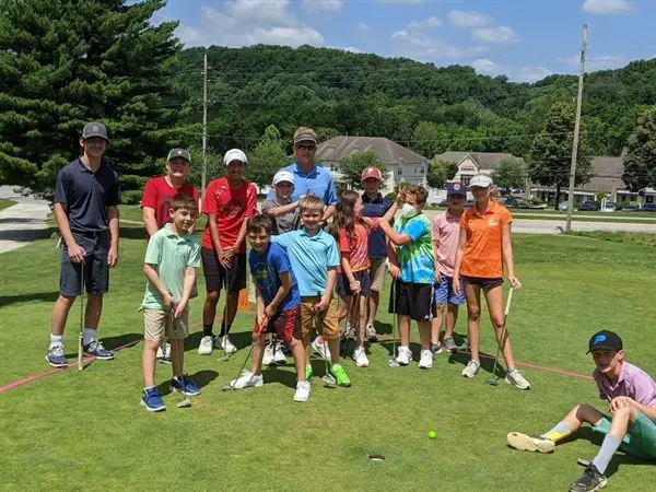 Play-a-Round Golf instructor with a group of young golfers